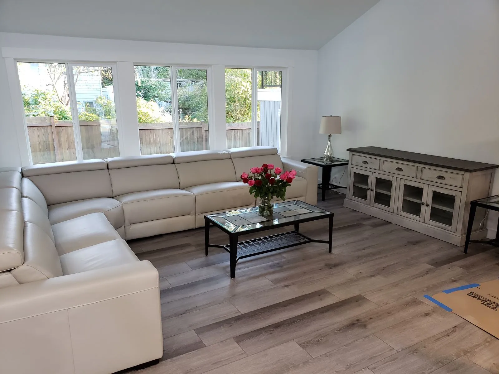 Wood-look plank floor in a living room with a white sofa