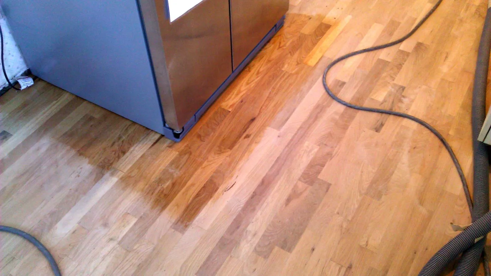Repaired and refinished hardwood floor